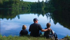 man fishing wit kids